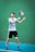 a man holding a tennis racquet on a tennis court