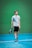 a man holding a tennis racquet on a tennis court