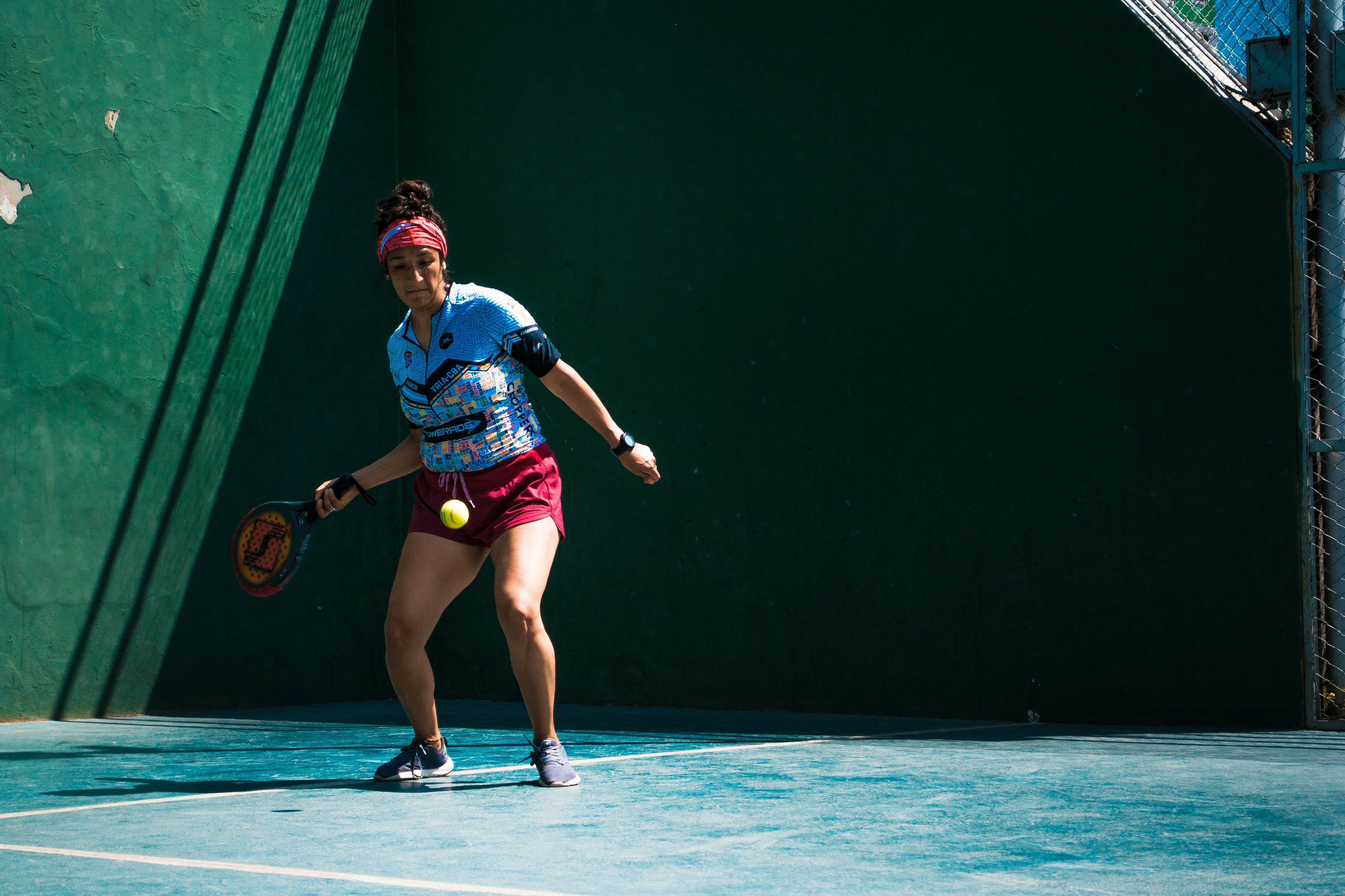 a female tennis player in action on the court