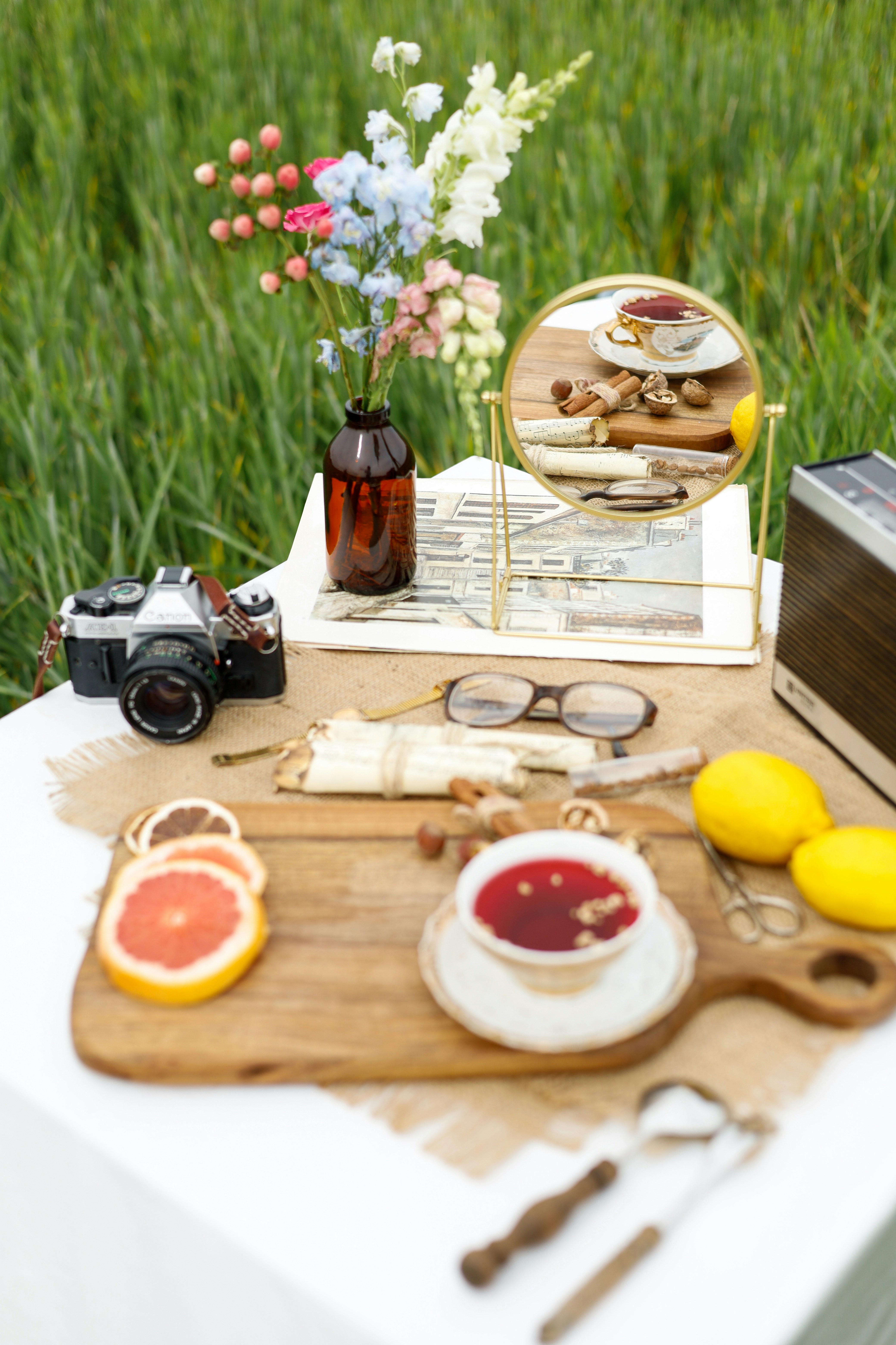 a table topped with a plate of food next to a mirror