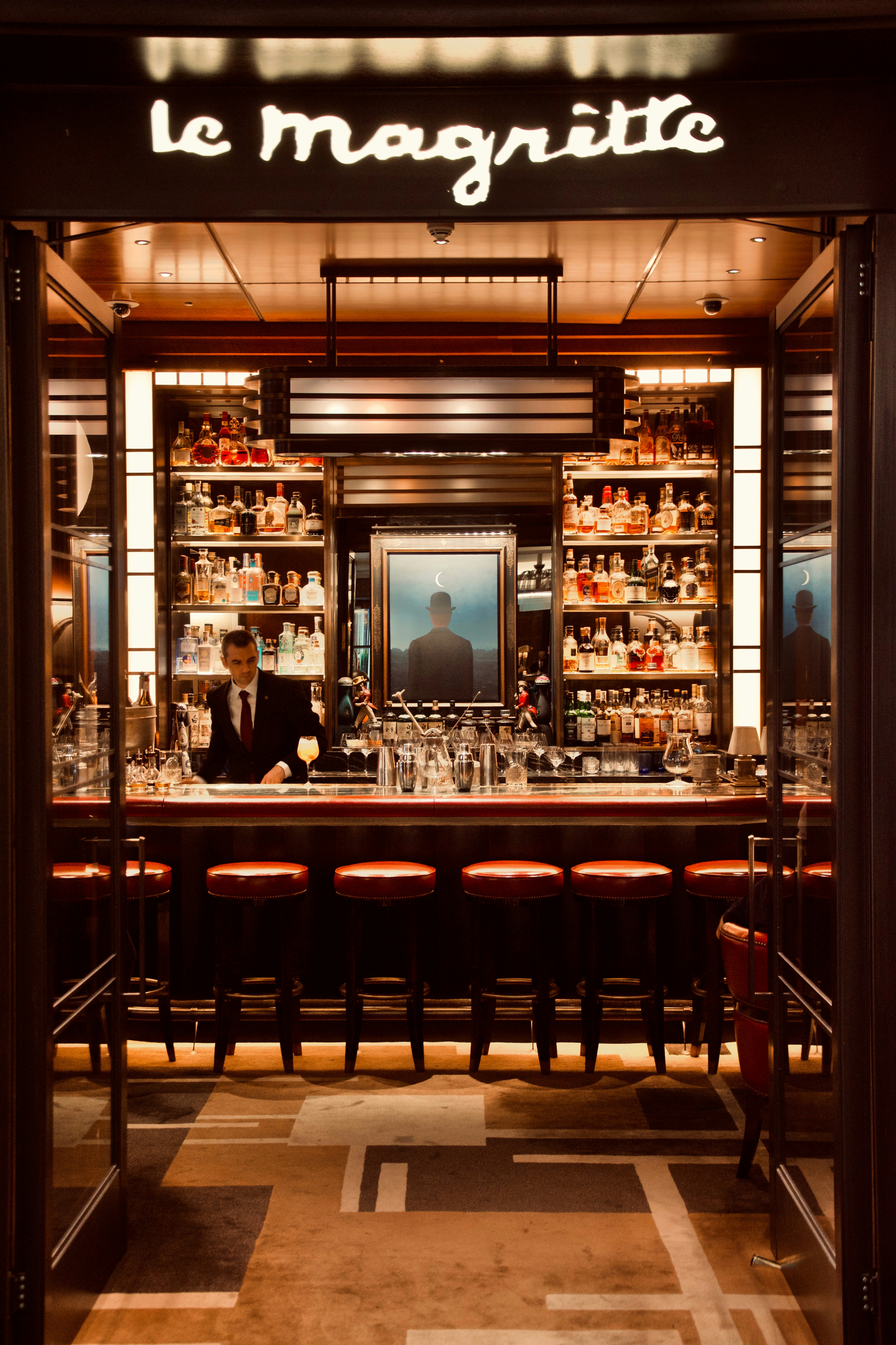 a man sitting at a bar in a restaurant