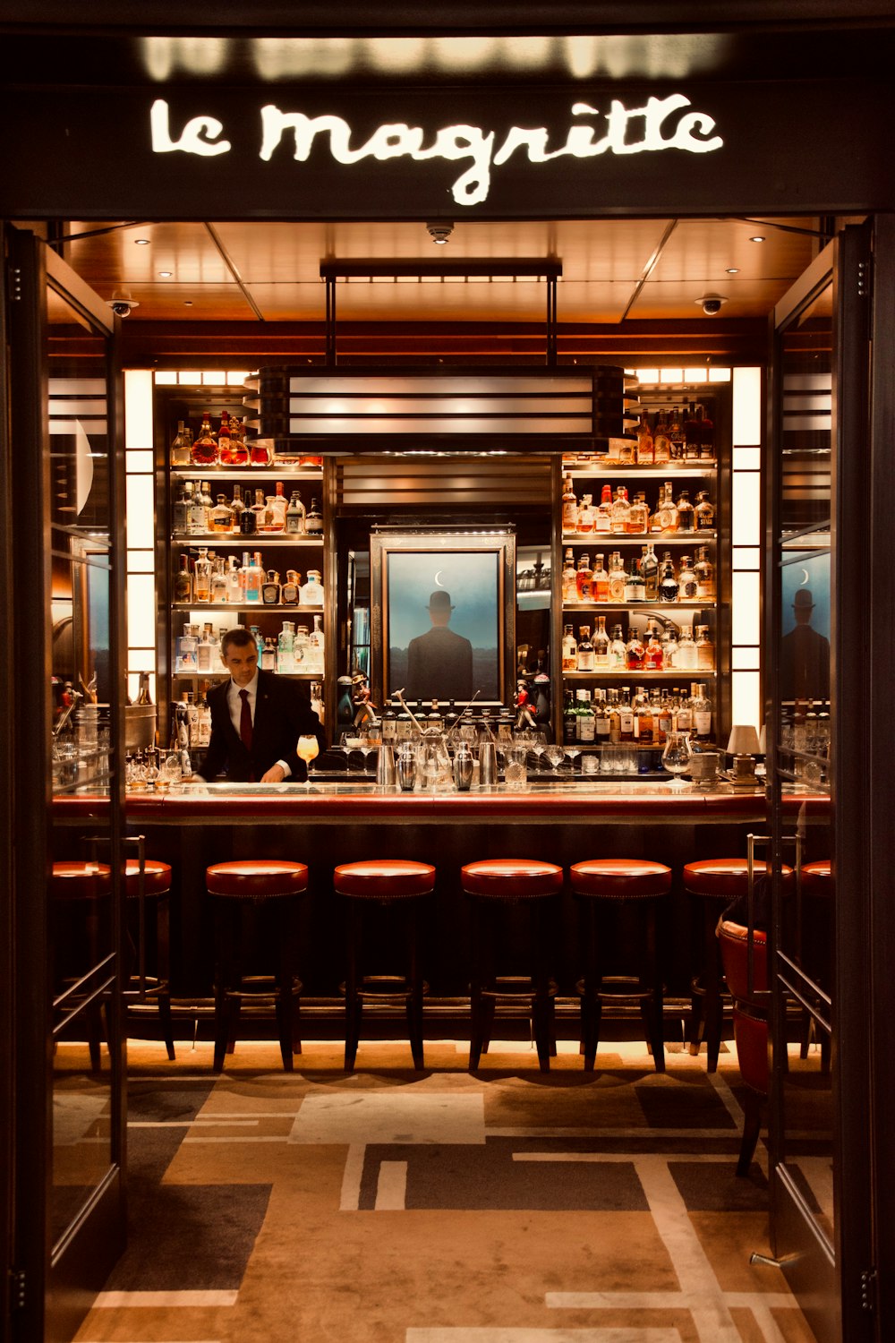 a man sitting at a bar in a restaurant