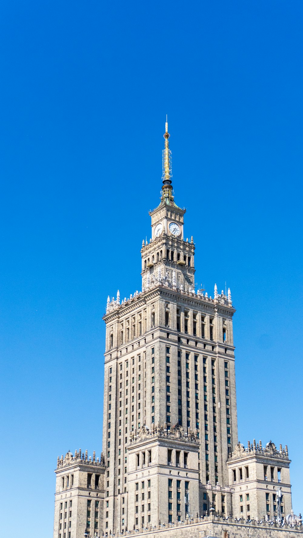 a very tall building with a clock on it's side