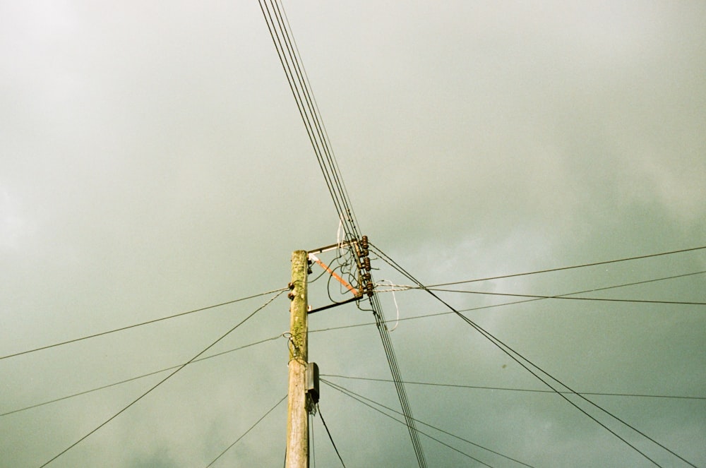 a telephone pole with a sky background