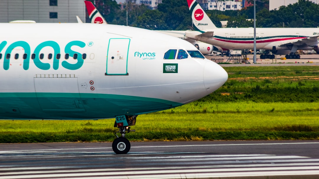 a large jetliner sitting on top of an airport runway, flynas A330 aircraft closeup