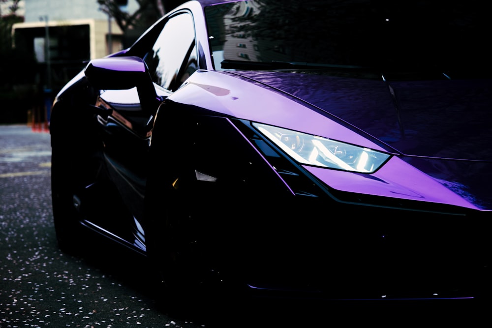 a purple car parked on the side of the road