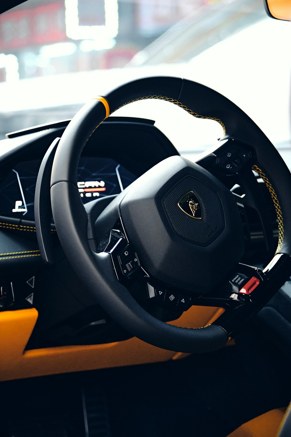 a close up of a steering wheel on a car