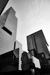 a black and white photo of skyscrapers in a city