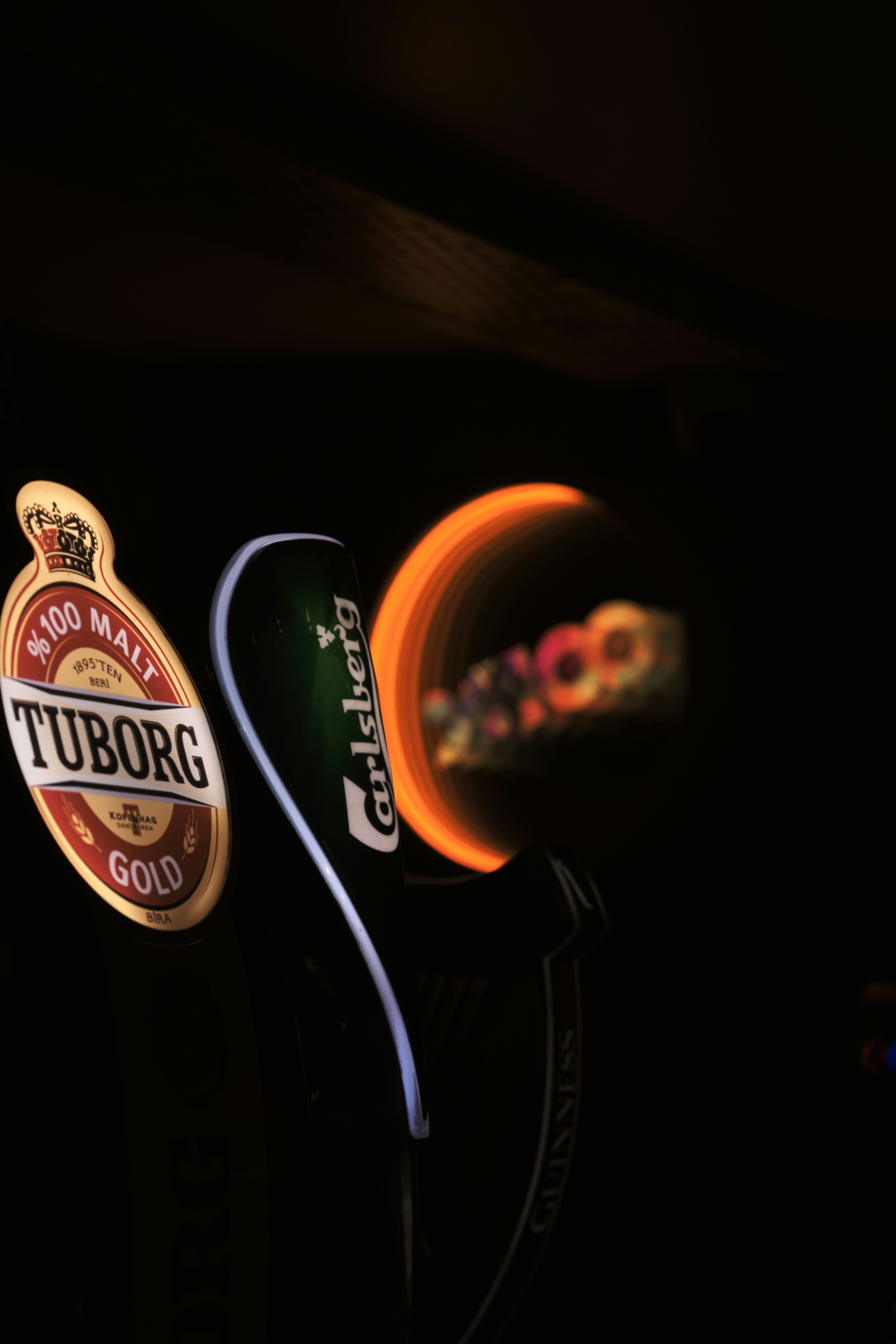 A couple of beer bottles sitting next to each other photo – Free ...