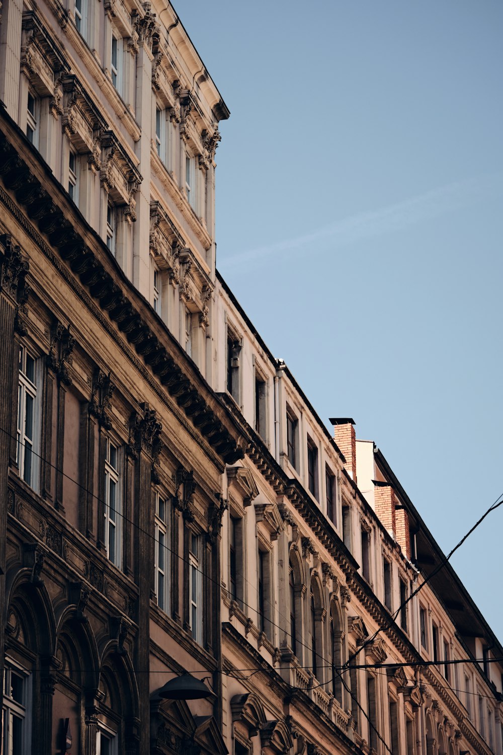 a tall building with a clock on the side of it