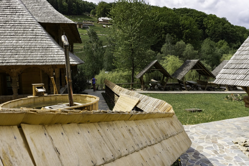 a wooden boat sitting on top of a stone walkway