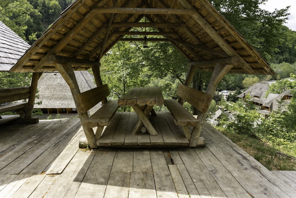 a picnic area with a picnic table and benches