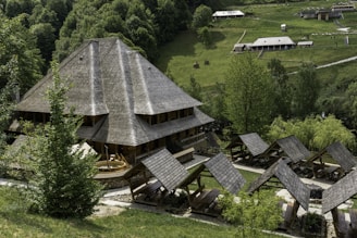 an aerial view of a house in the middle of a forest