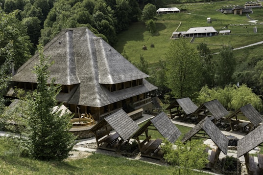 an aerial view of a house in the middle of a forest