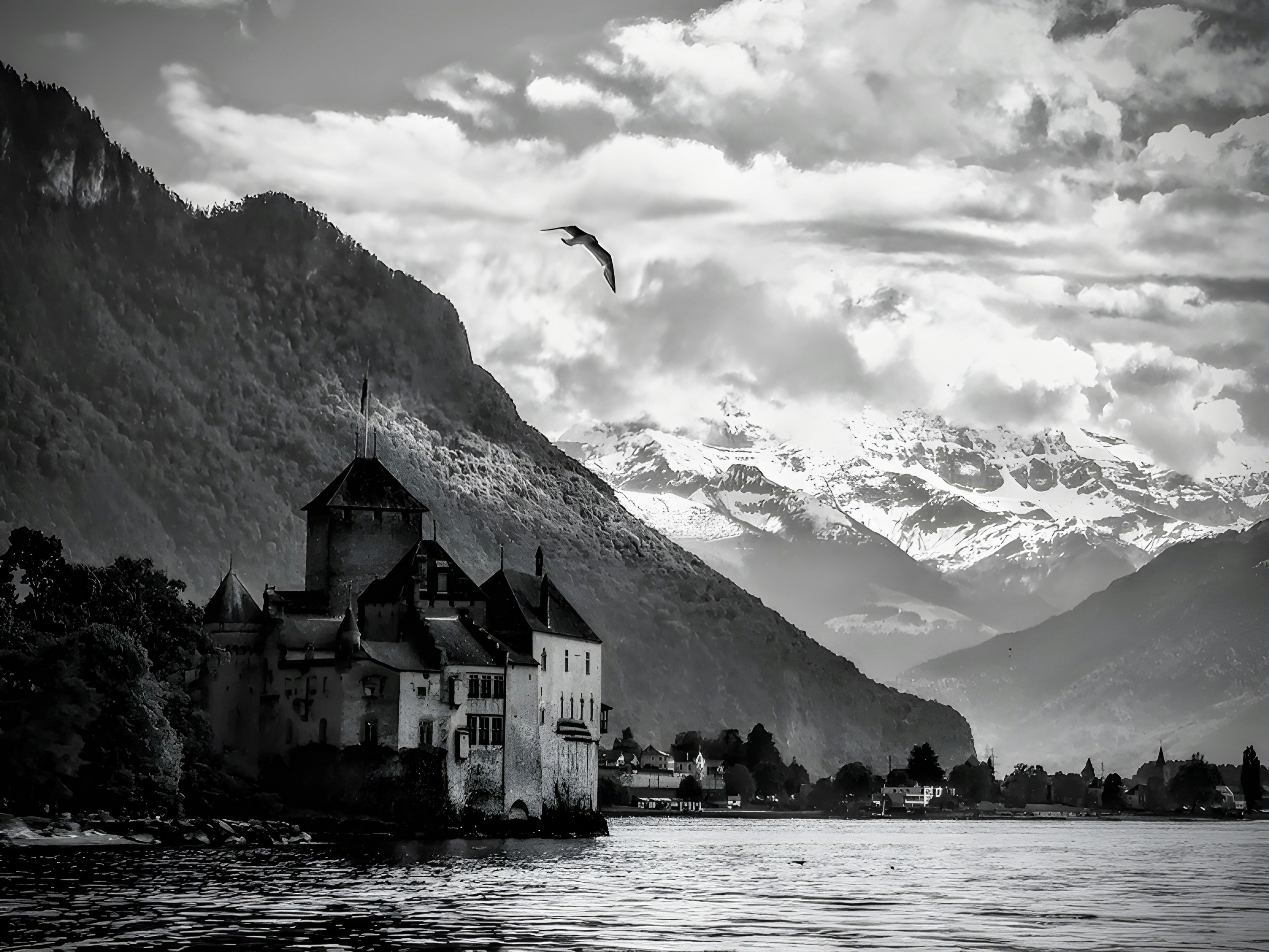 a black and white photo of a castle on a lake