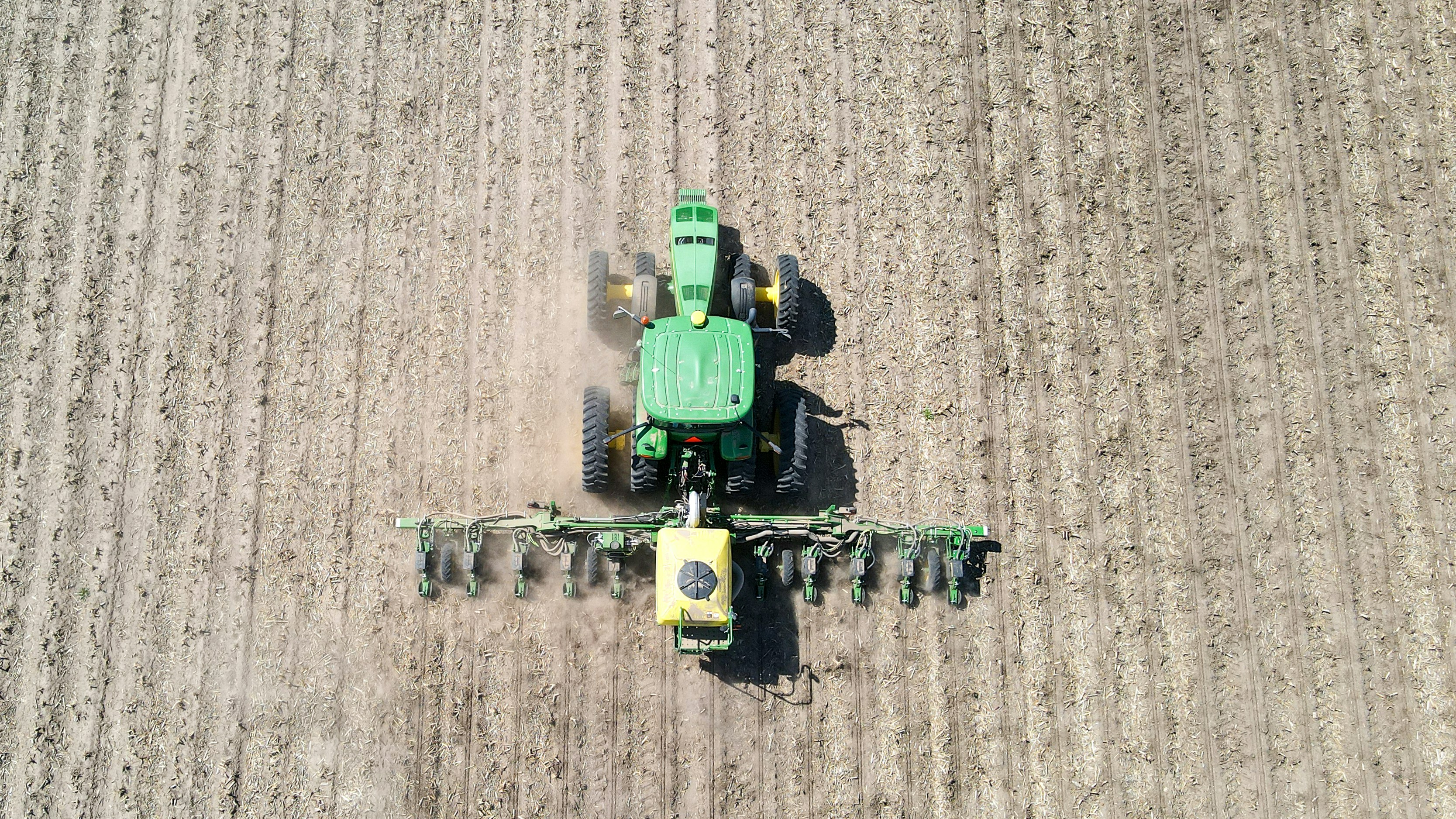 a large green tractor in a field
