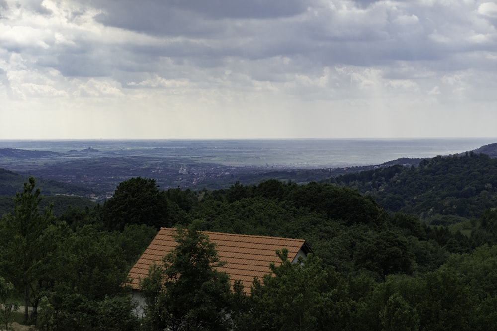 a house on a hill with a view of the ocean