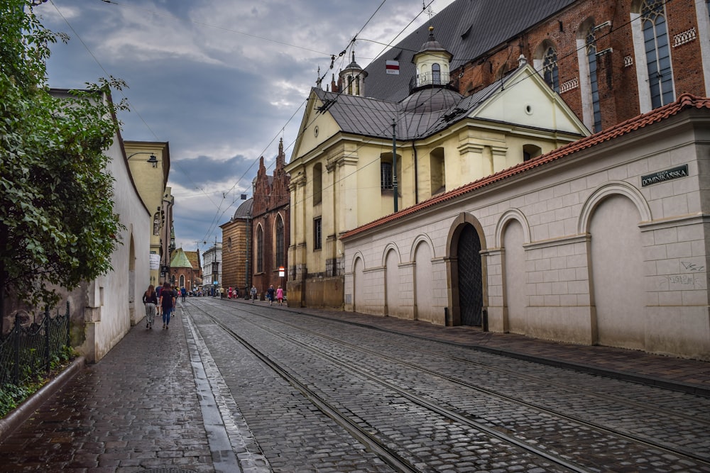 a cobblestone street lined with old buildings