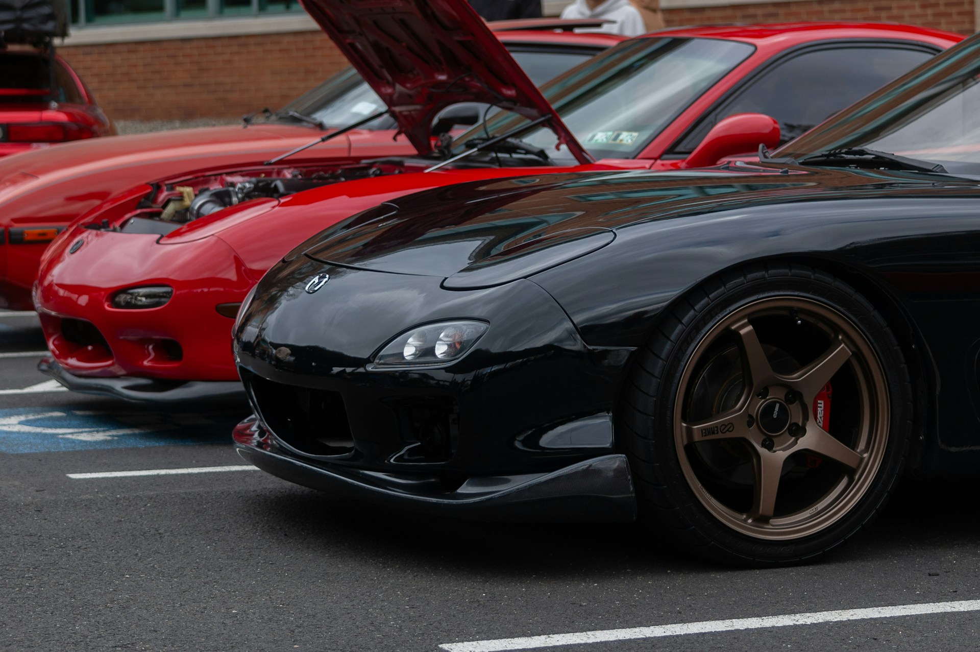 a group of cars parked next to each other in a parking lot
