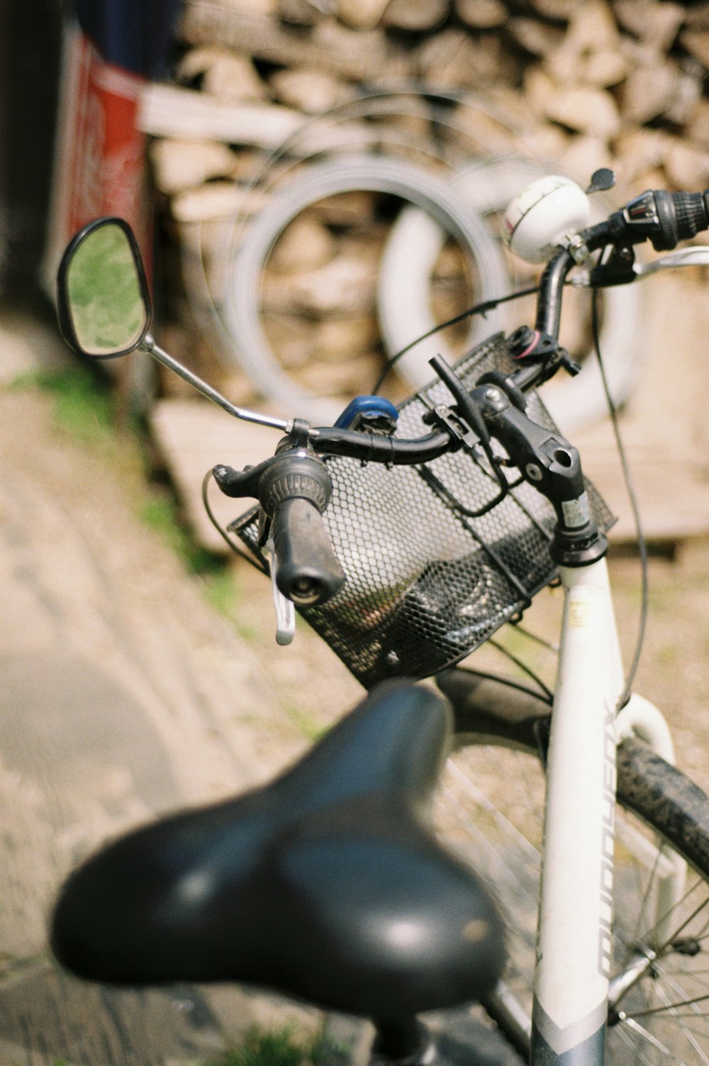 a close up of a bicycle handlebar with a bag on it
