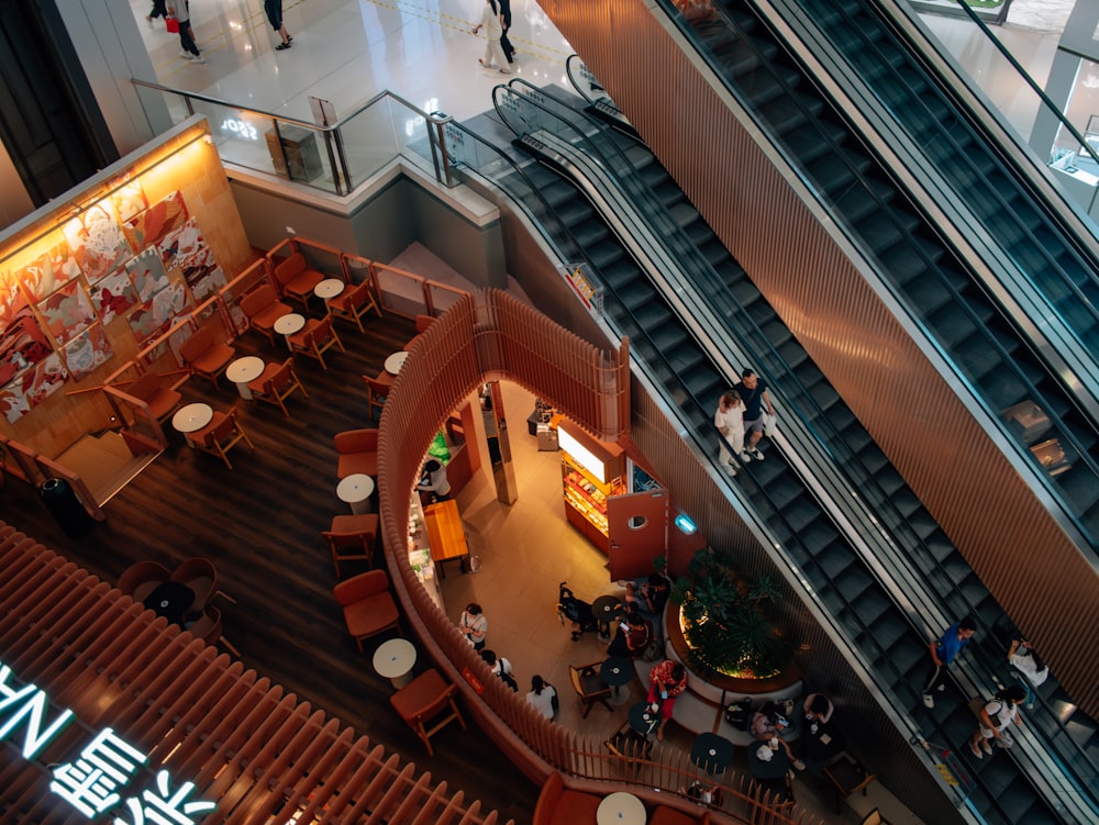 an overhead view of a restaurant with escalators
