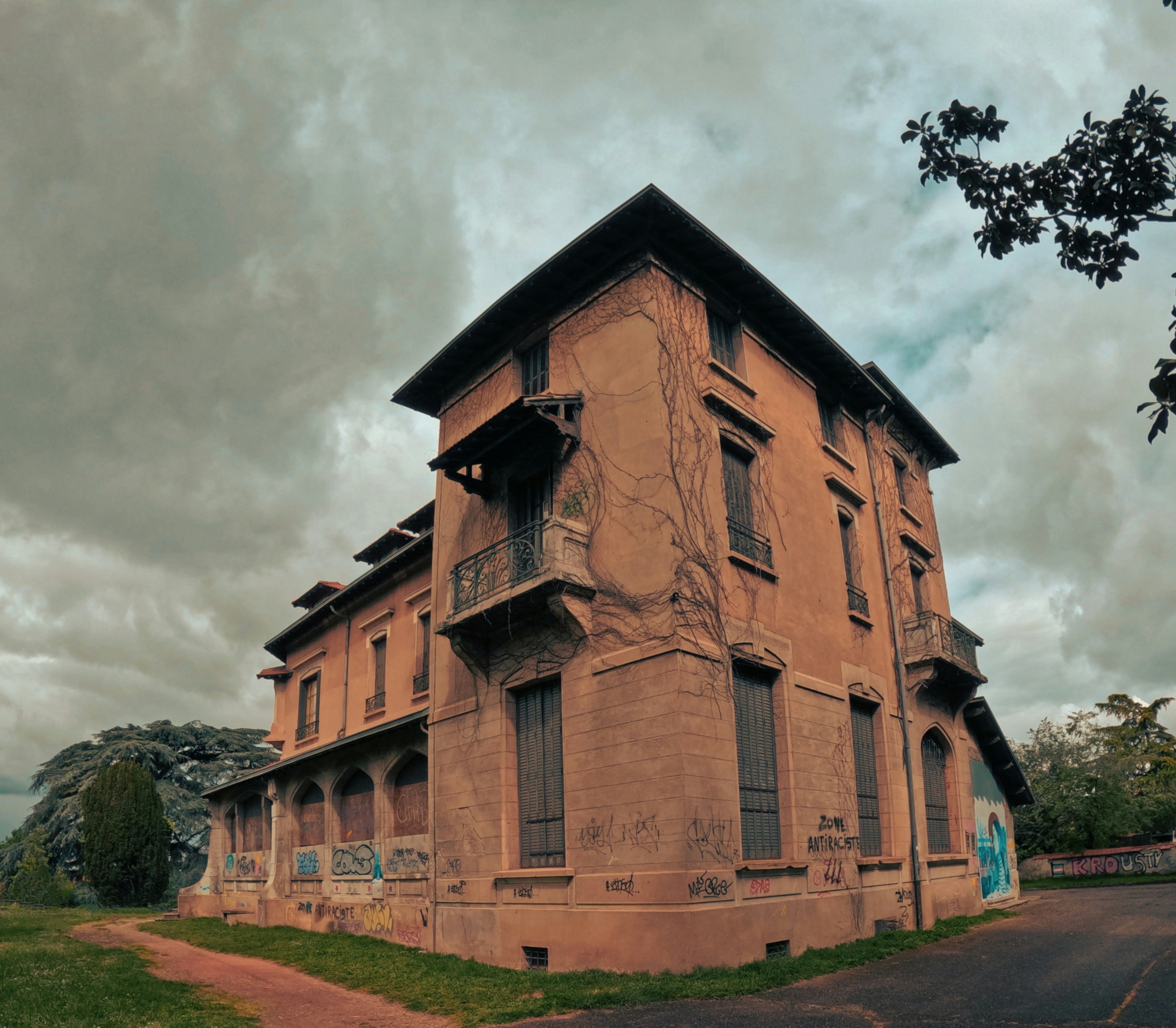 an old building with graffiti on the side of it