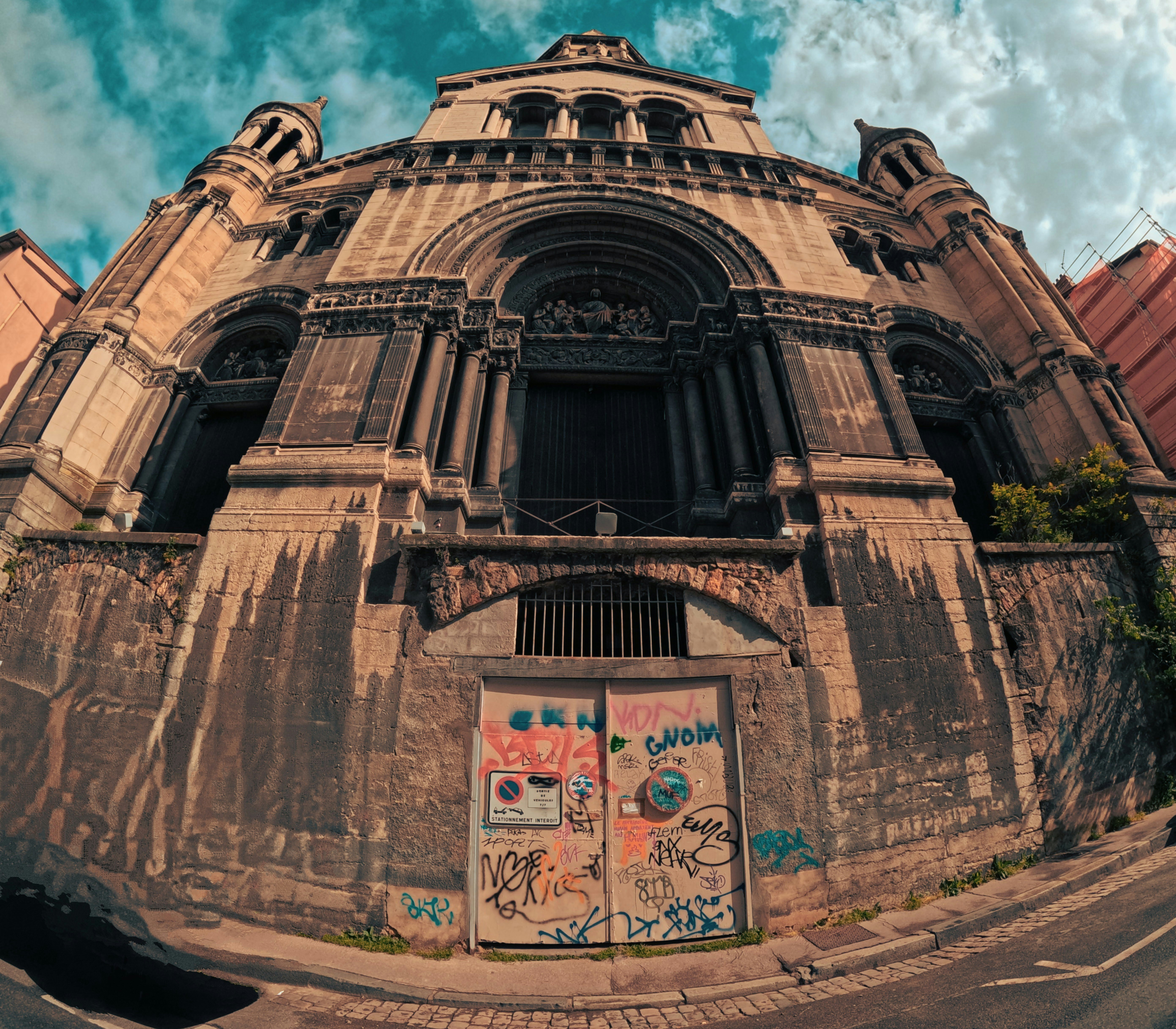 a very old building with graffiti on it