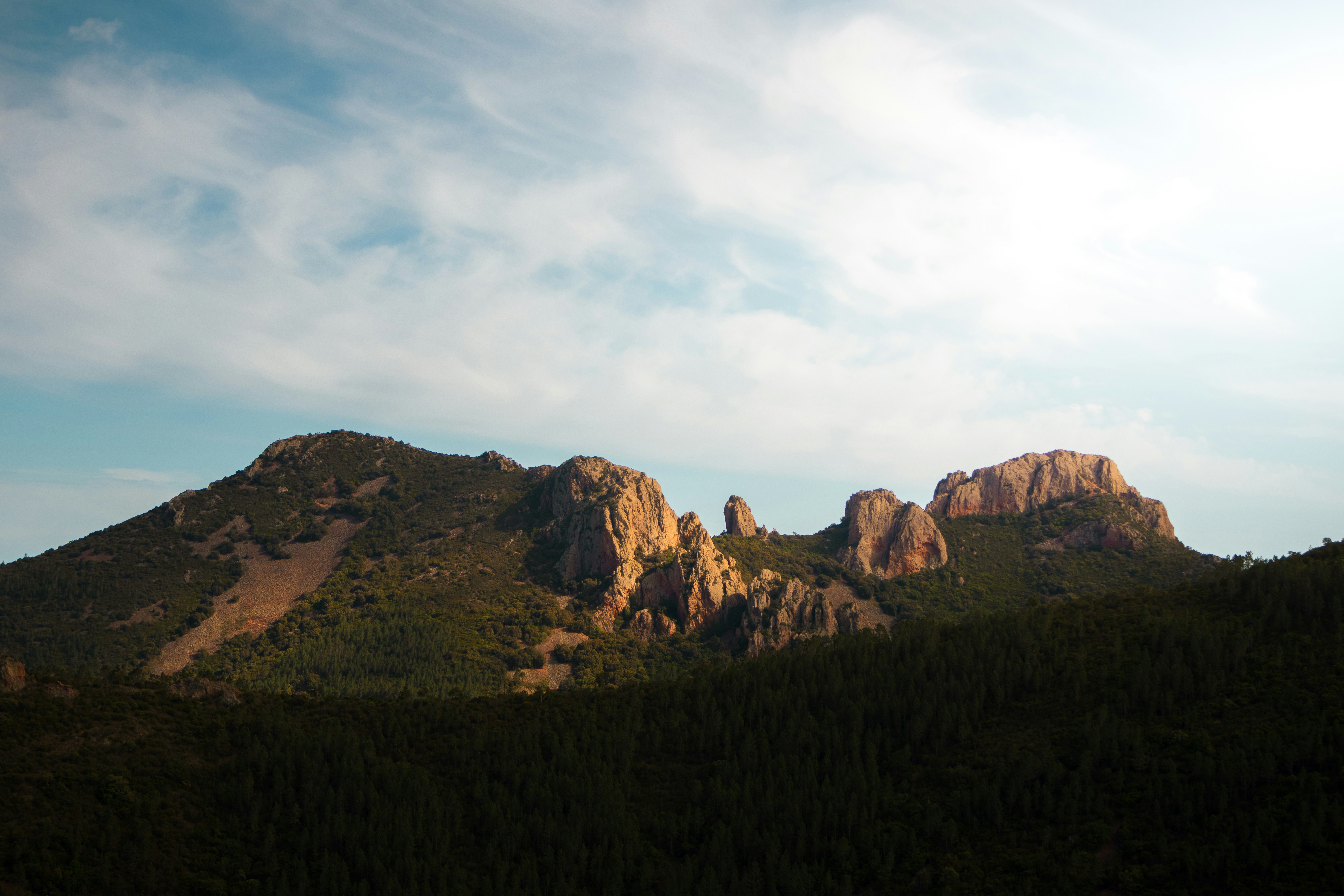 a group of mountains with trees on each side, 