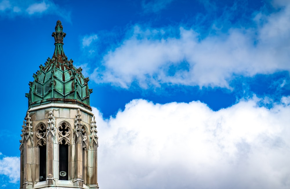 a tall clock tower with a sky background