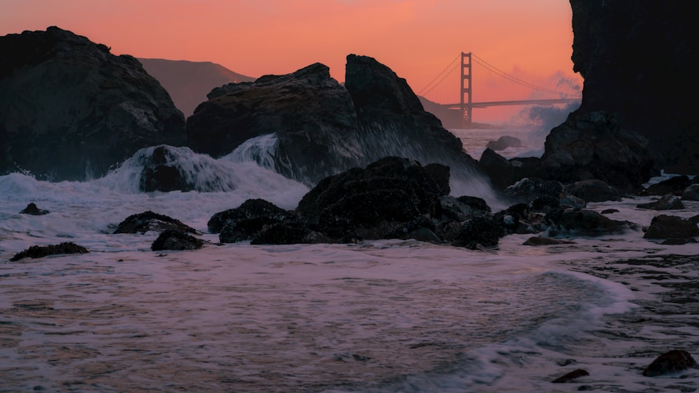 a view of the golden gate bridge at sunset