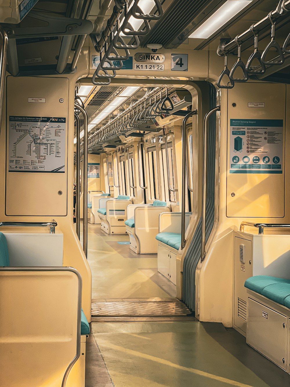 the inside of a train car with blue seats