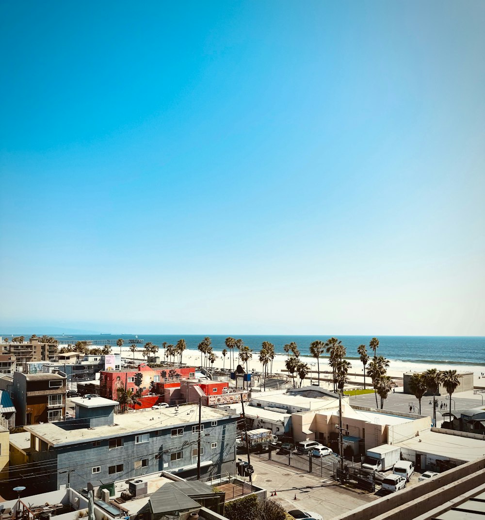 a view of the beach from a rooftop of a building