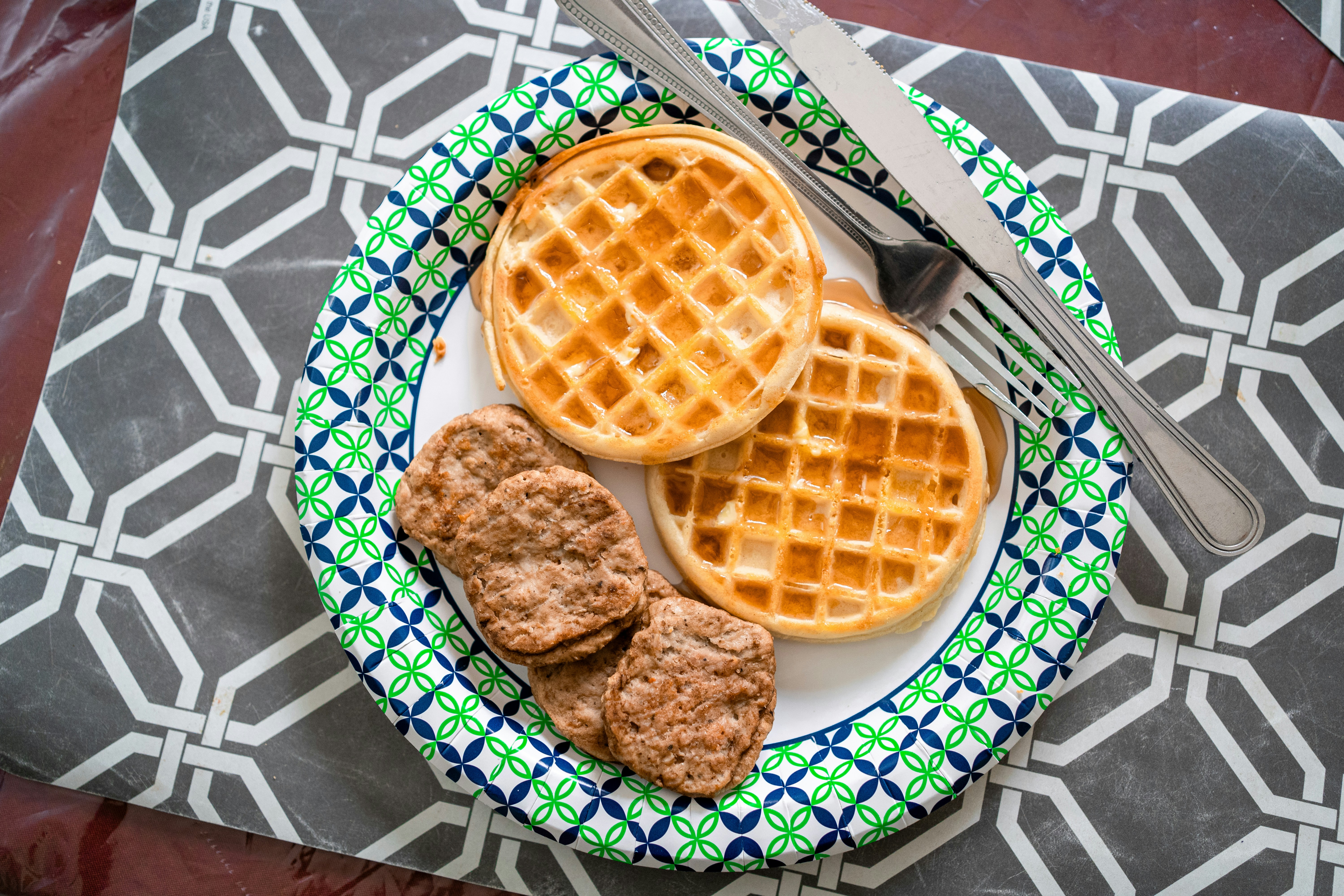a plate with waffles and biscuits on it