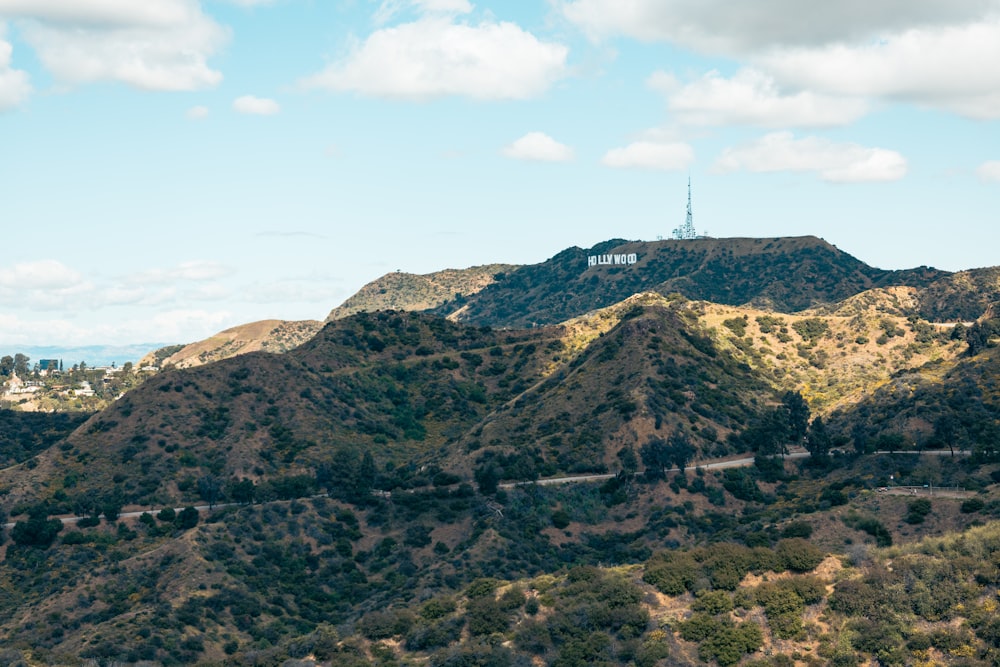 a scenic view of a mountain with a radio tower in the distance