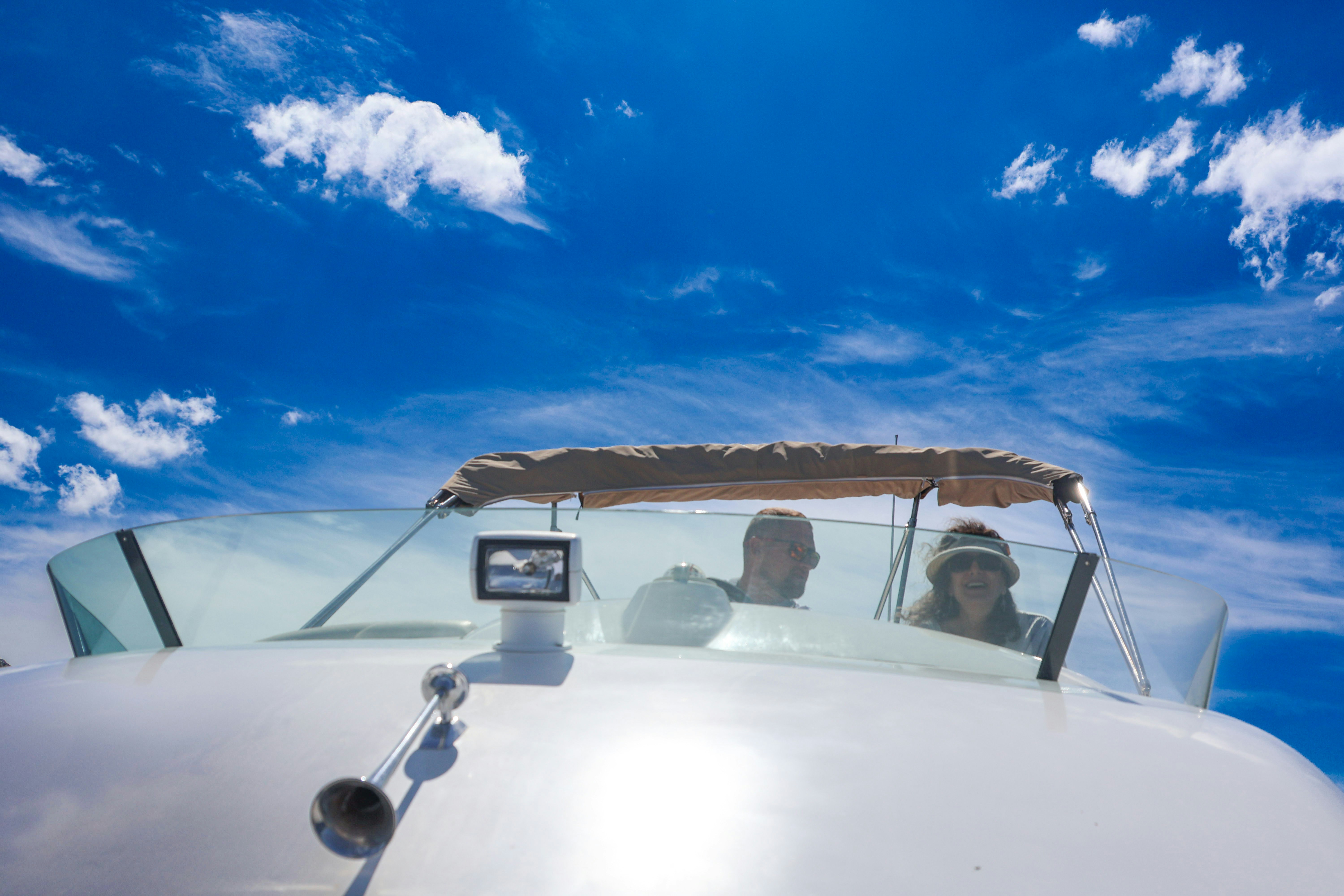 a man and a woman sitting in the cockpit of a plane