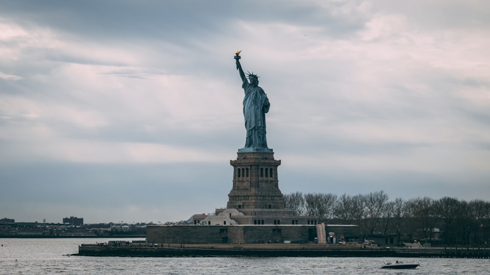 the statue of liberty is in the middle of the water