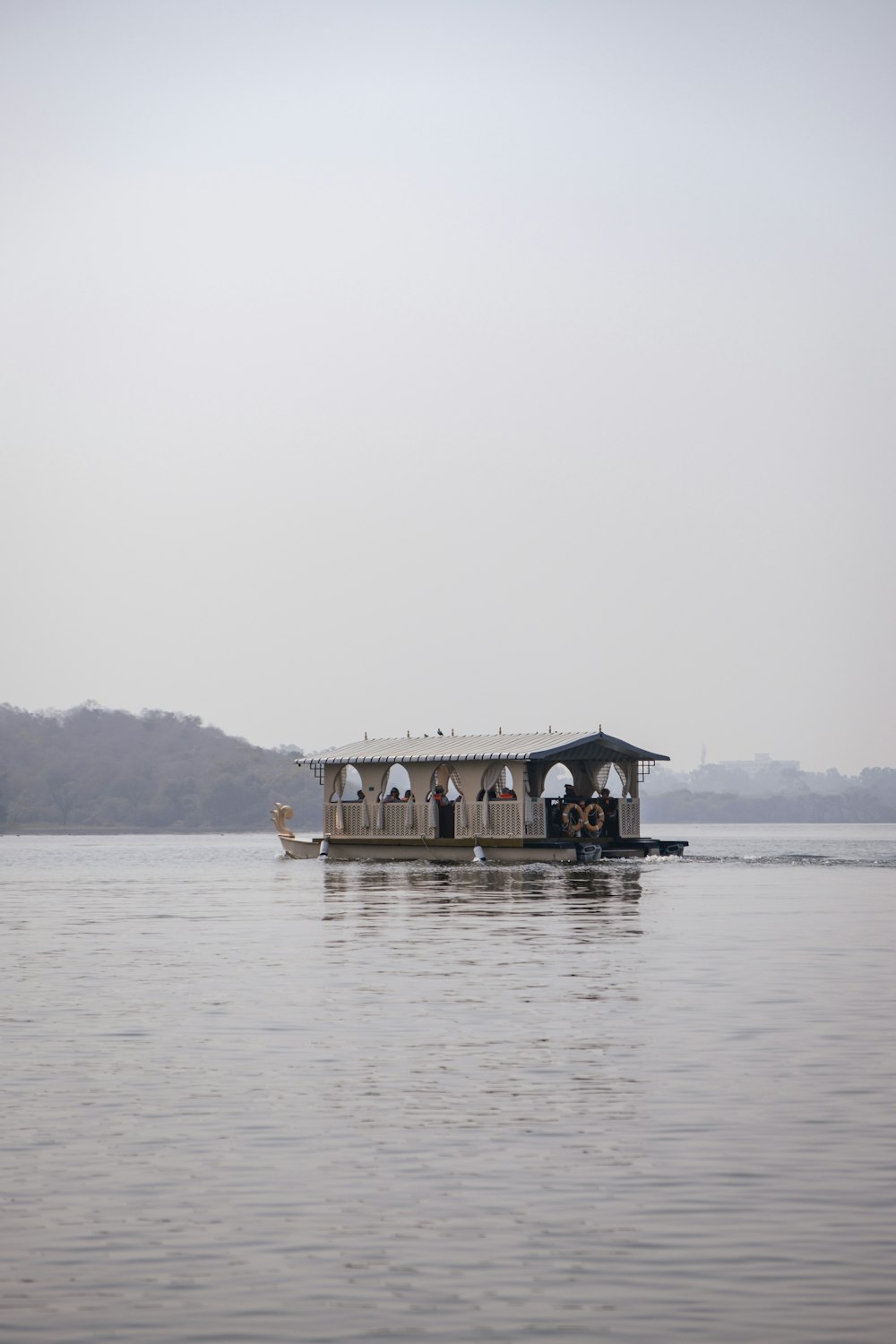 a houseboat is floating on the water