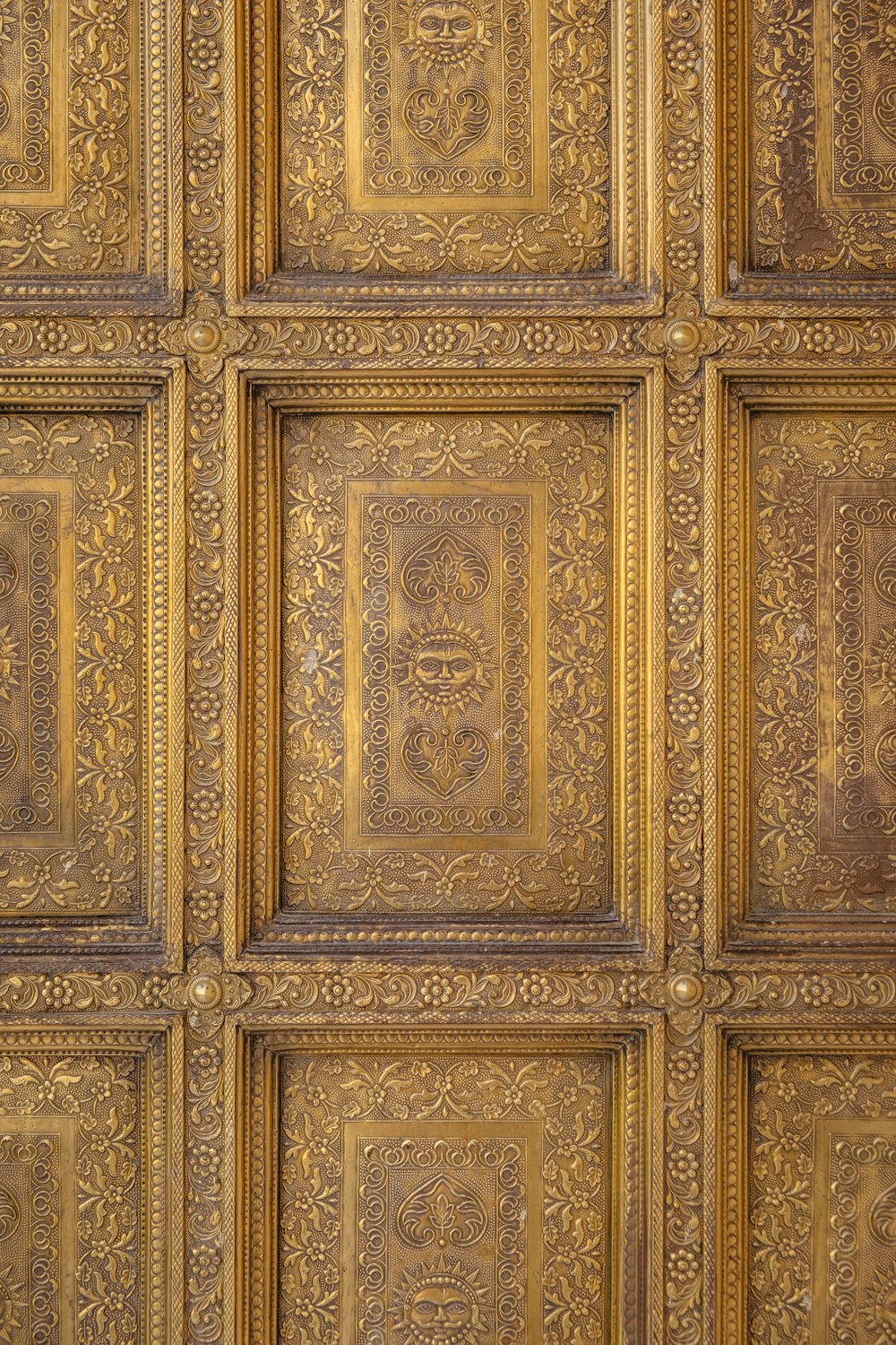 a close up of a wall with a clock on it