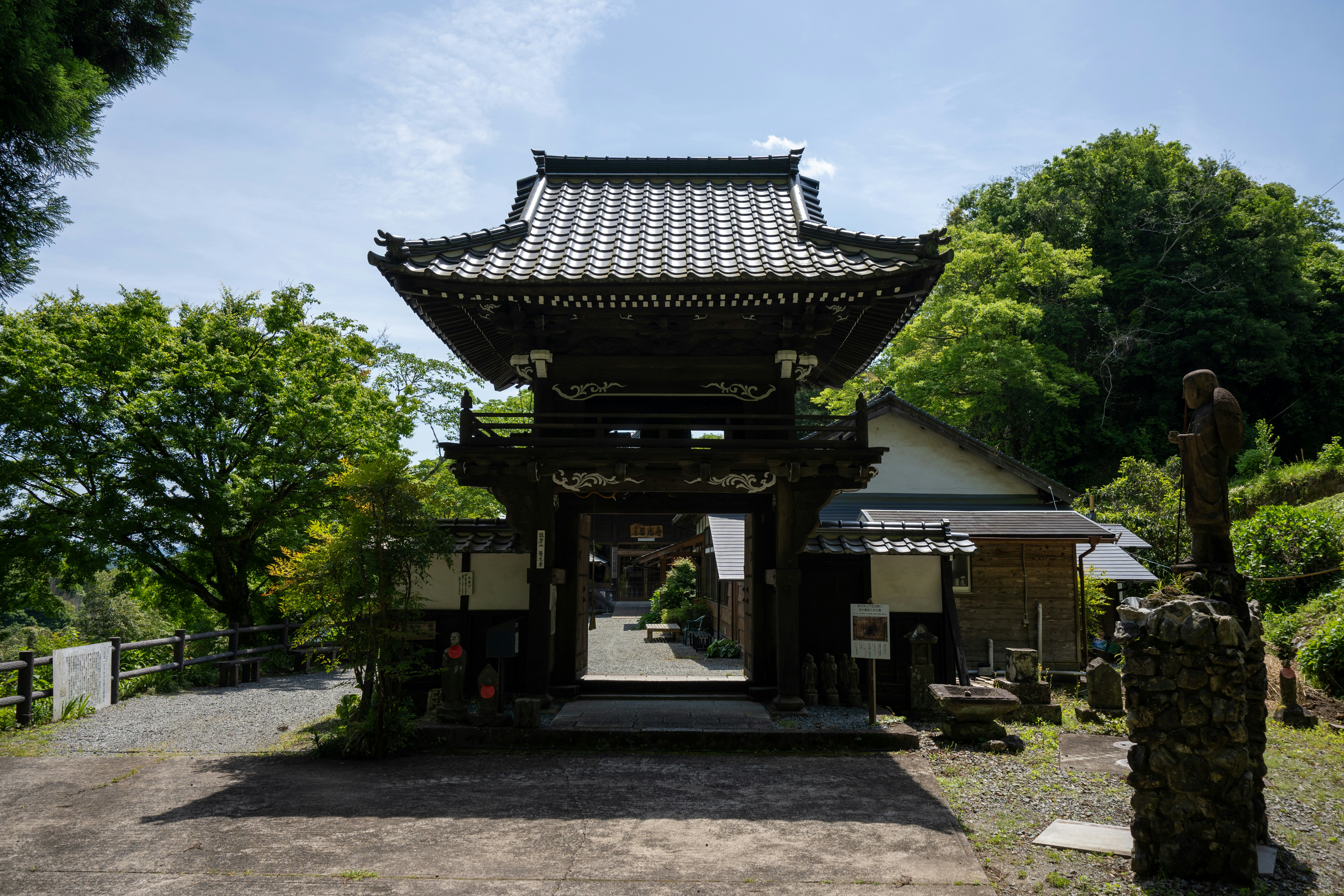 a small building with a gate in front of it