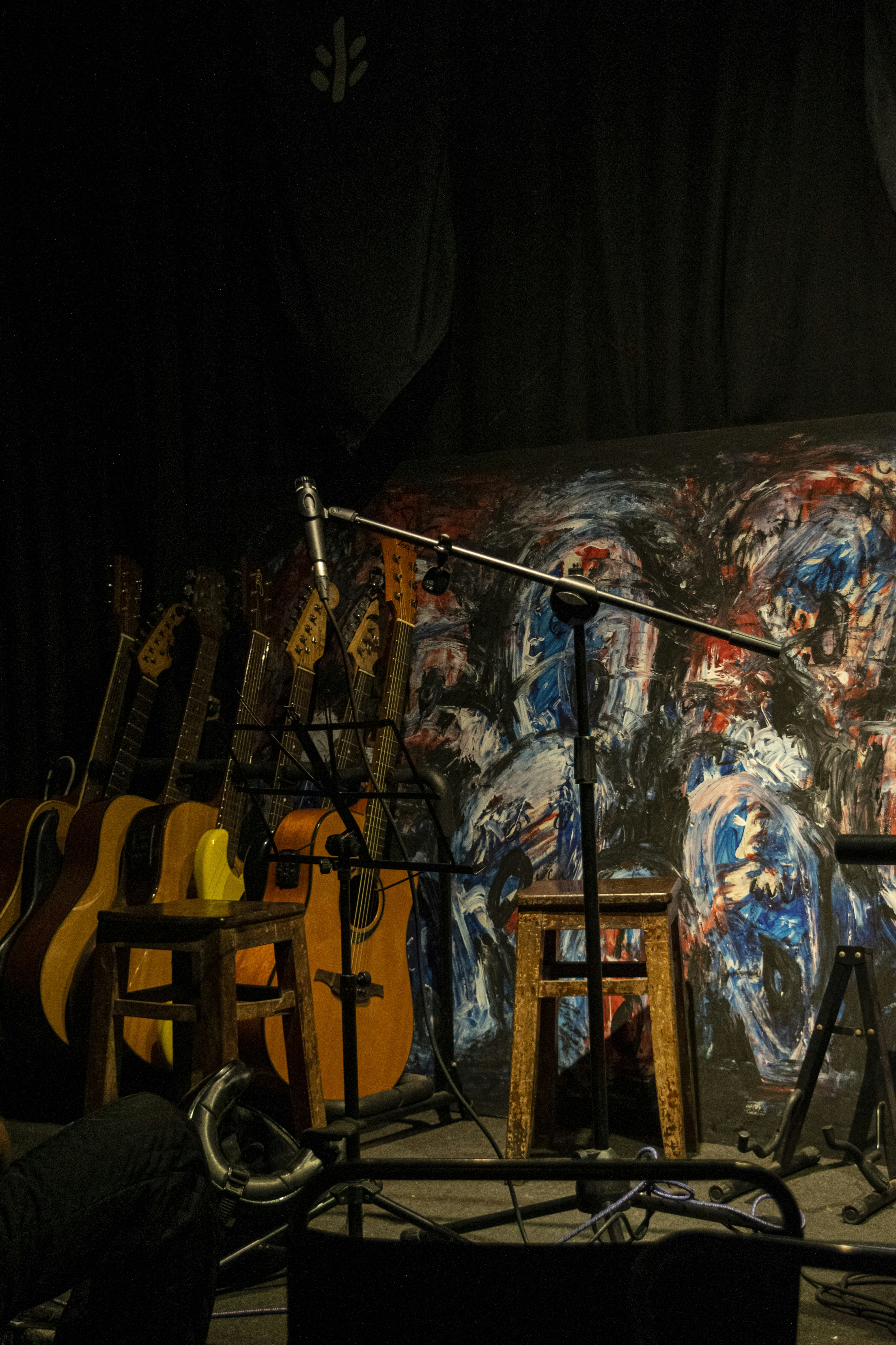 a group of guitars sitting on top of a stage