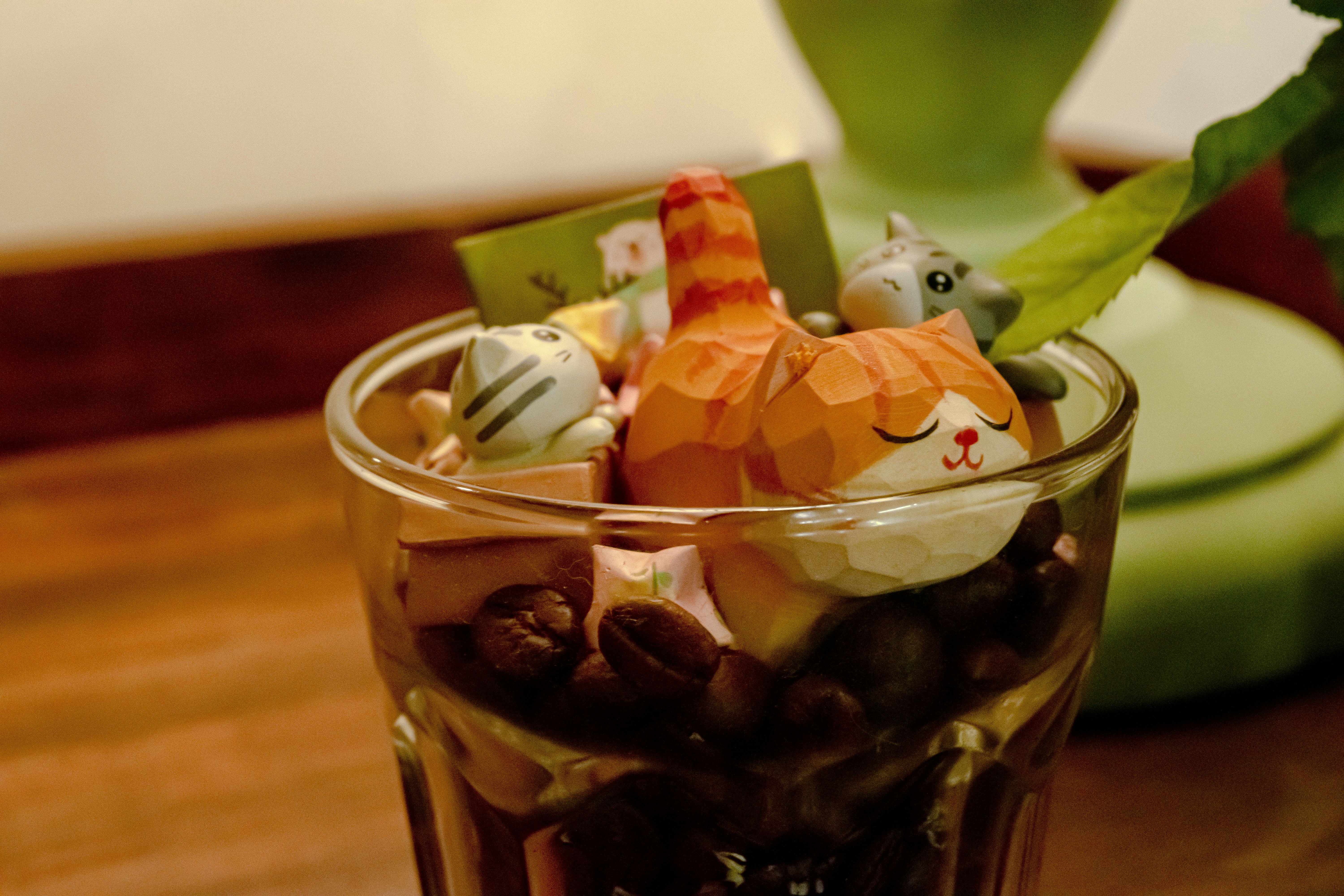 a glass filled with different types of candies