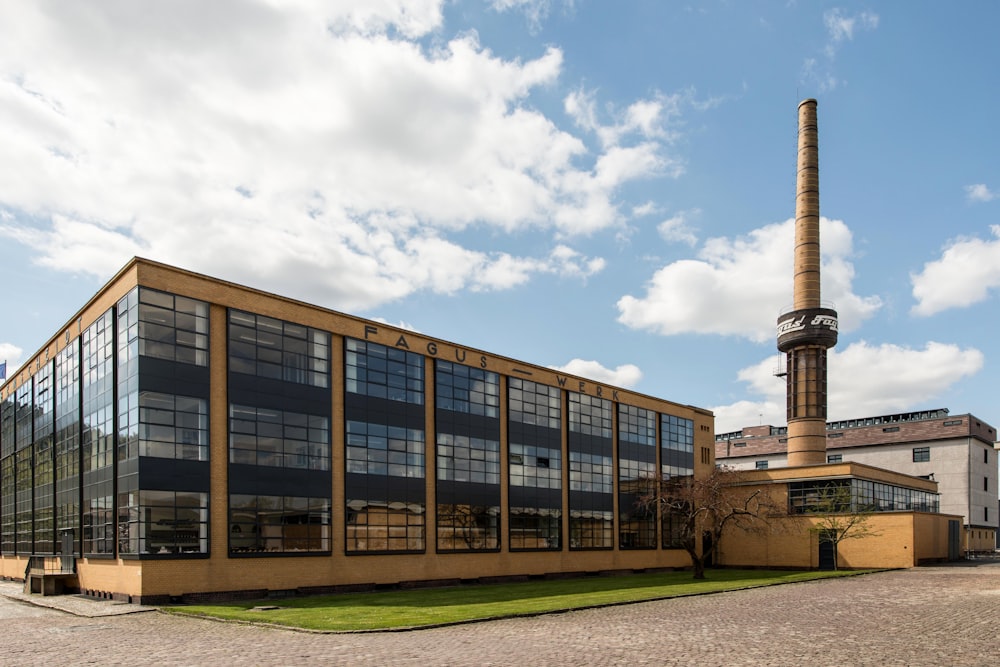 a large building with a tower in the background