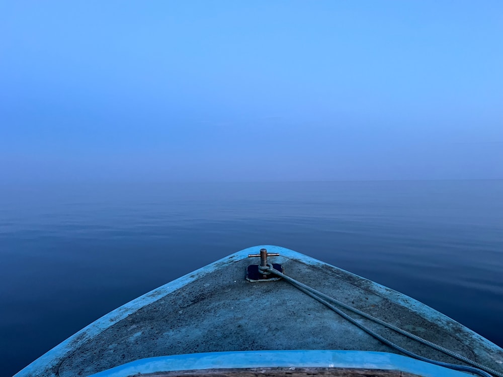 a view of the back end of a boat in the water