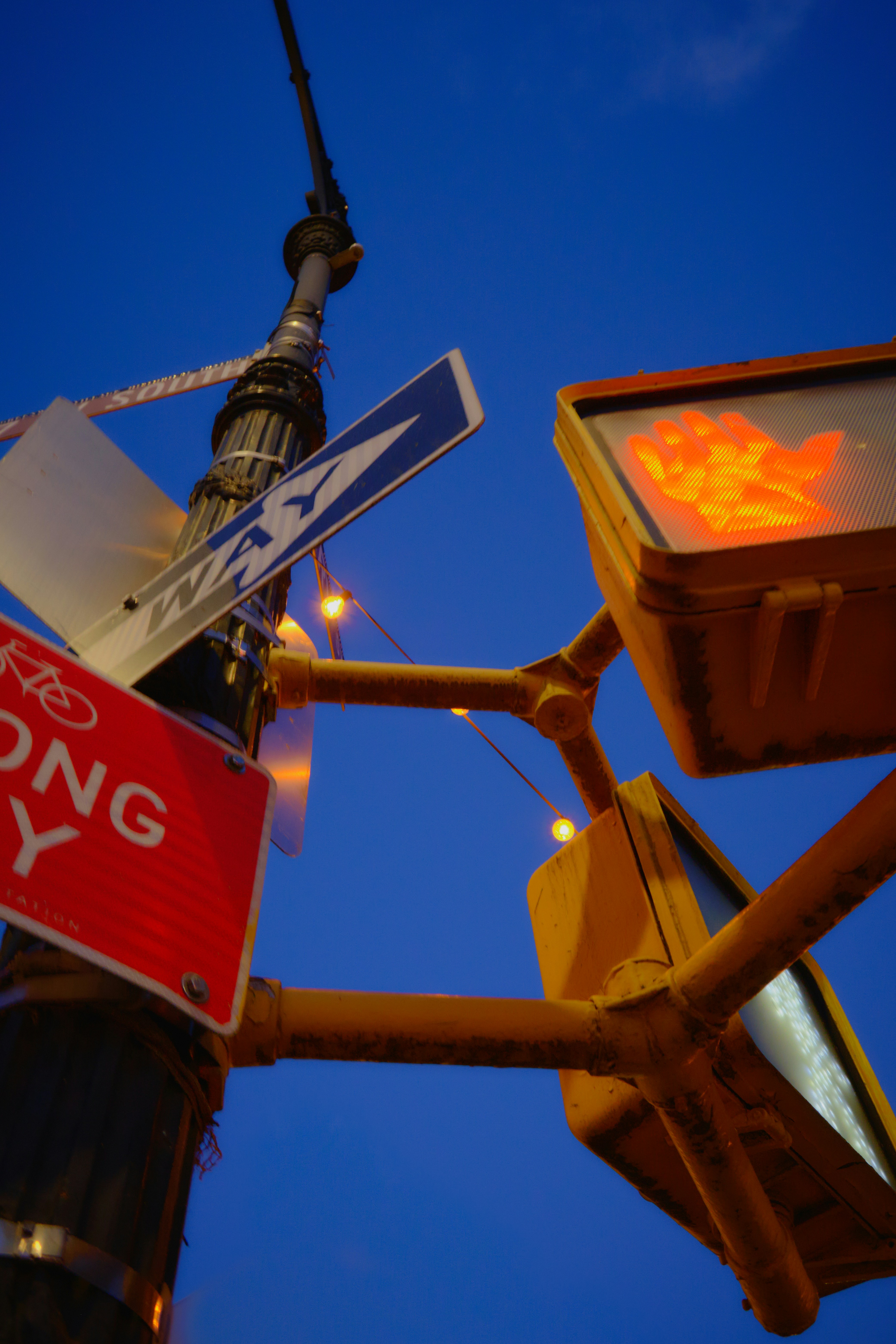 A traffic light with street signs attached to it photo – Free Geometric ...