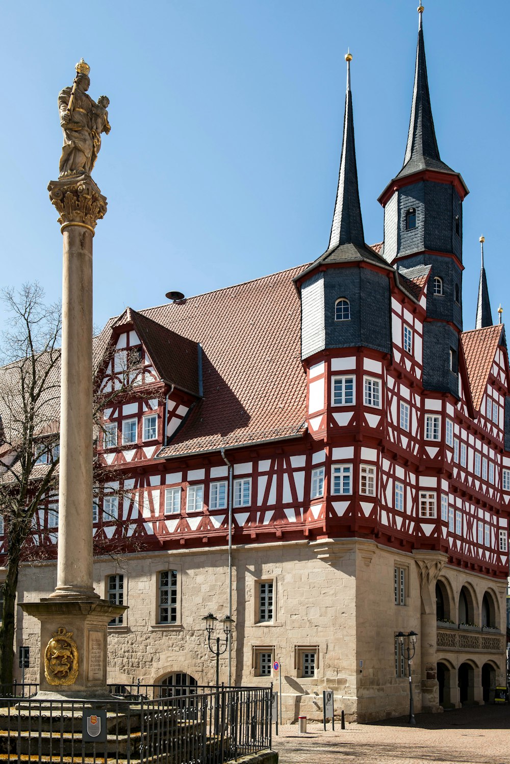 a tall building with two towers and a clock