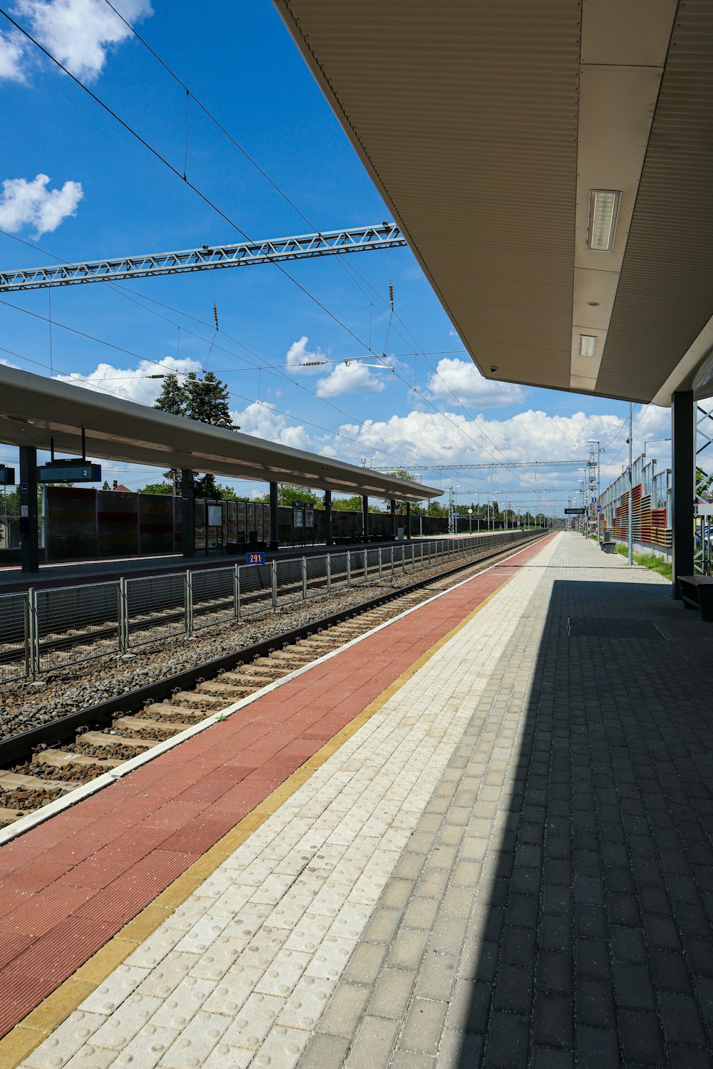 a train station with a train on the tracks