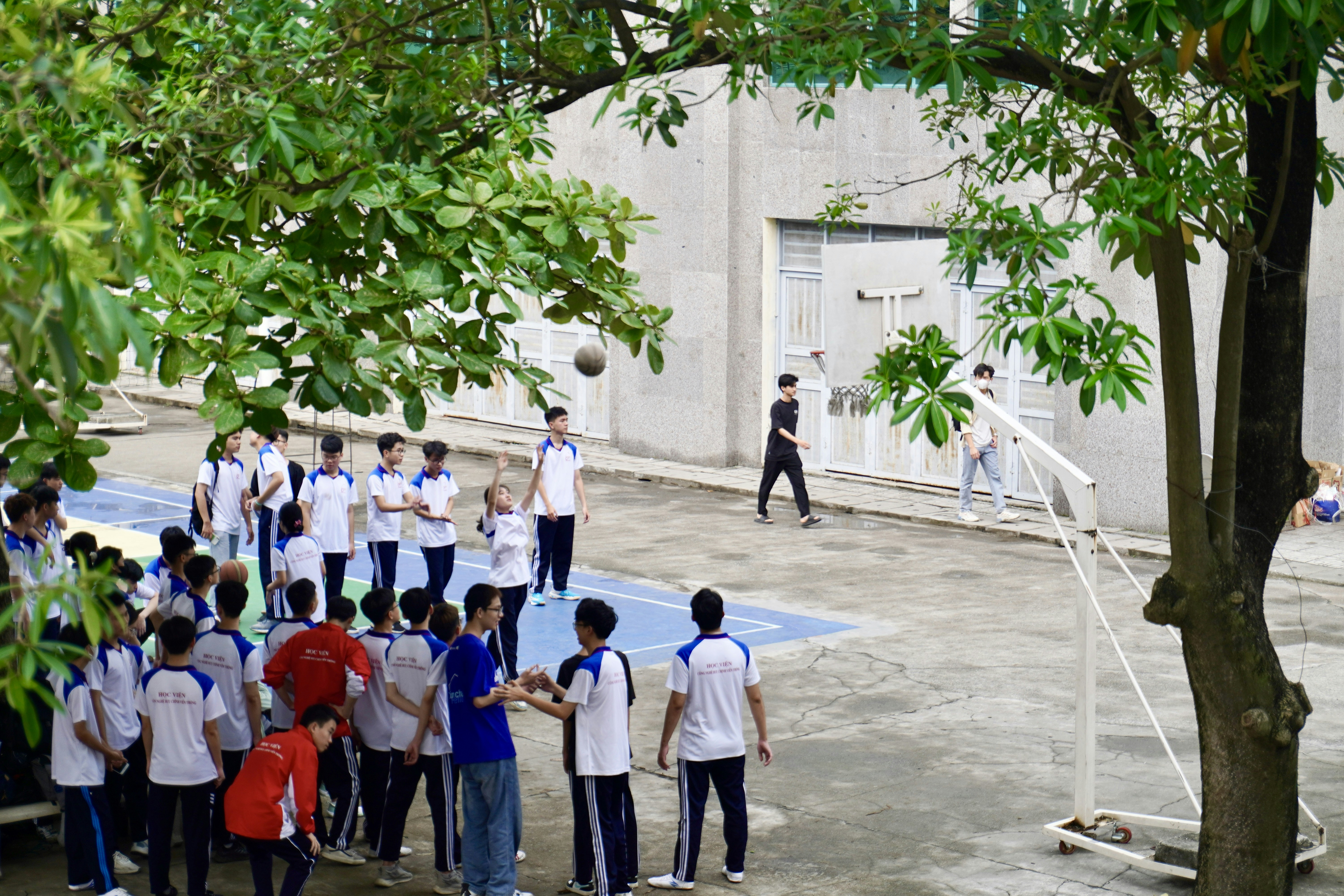 a group of people playing a game of volleyball