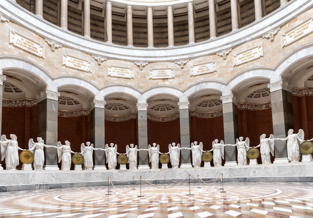 a group of statues in a large room