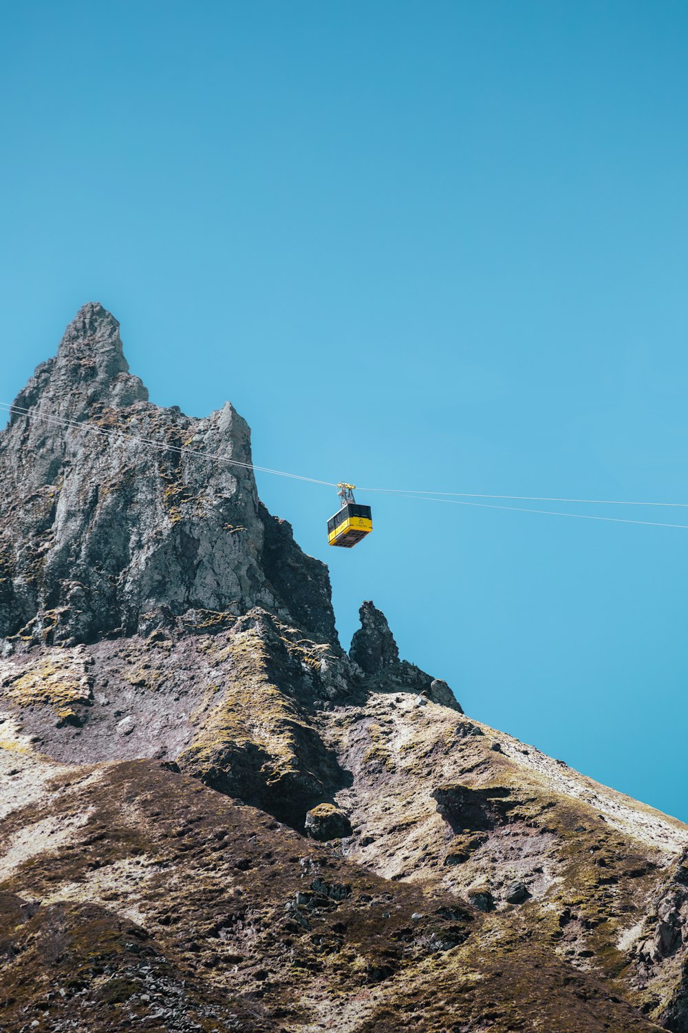 a kite is being flown over a mountain