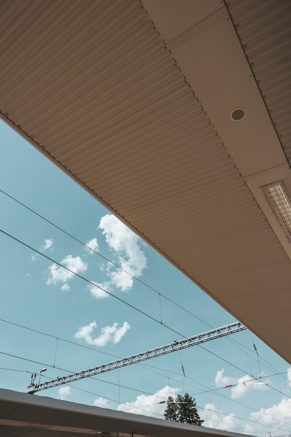 a view of the sky from underneath a building